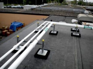 h-stands with pipe clamps installed on roof